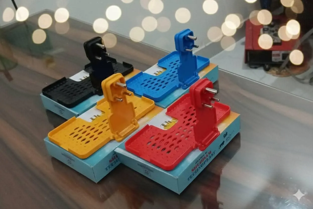 Keep your mobile phone organised near your charging point with this foldable mobile charging holder. The plastic tray features a centred three-pin upright, a folding hinge, perforated openings and raised edges. Use the holder to rest your phone while char
