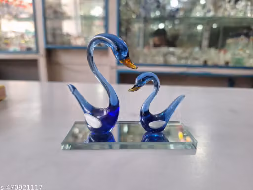 A BEAUTIFUL GLASS SHOWPIECE OF DUCK OF BLUE COLOUR.