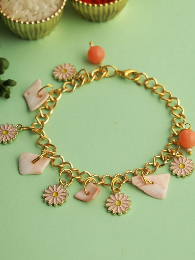 Pink Floral Charm Bracelet Rakhi (Rakhi is included with Roli Chawal & Greetings Card)