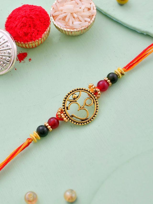 Om Designed Simple Rakhi (Rakhi is included with Roli Chawal & Greetings Card)
