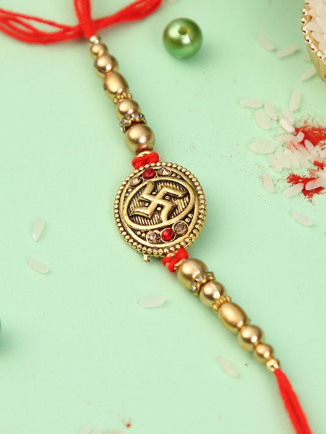 Golden Swastik Pearl Rakhi (Rakhi is included with Roli Chawal & Greetings Card)