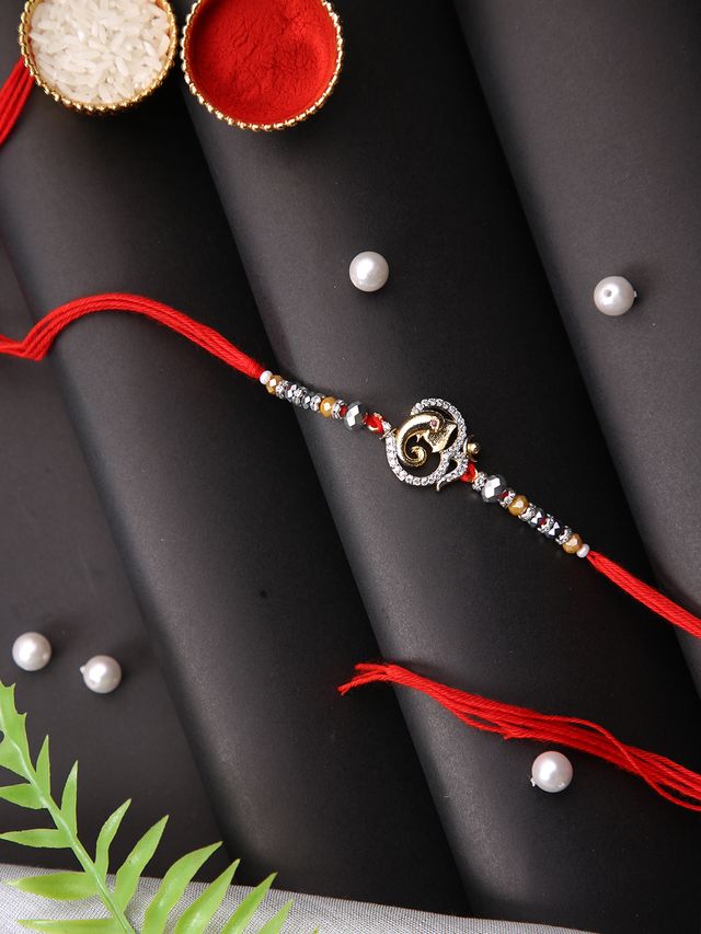Om & Ganesha Designed Single Rakhi (Rakhi is included with Roli Chawal & Greetings Card)