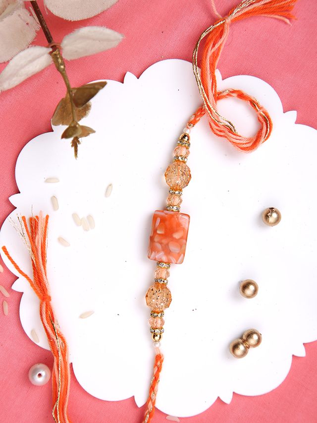 Orange Resin Beaded Multistrand Rakhi (Rakhi is included with Roli Chawal & Greetings Card)