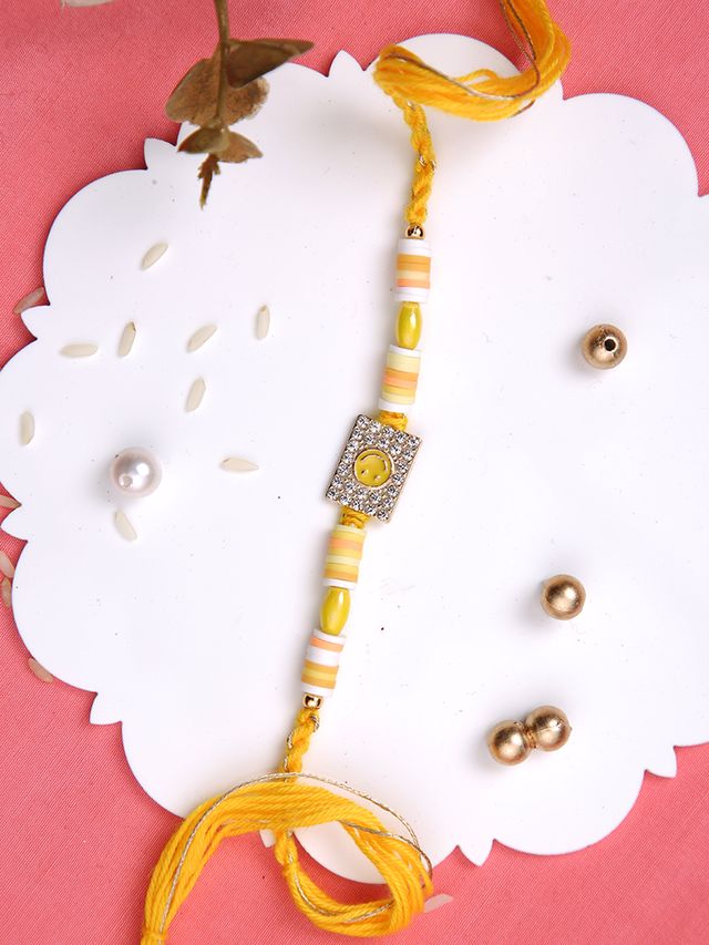 Yellow Smiley Stone Studded Multistrand Rakhi (Rakhi is included with Roli Chawal & Greetings Card)
