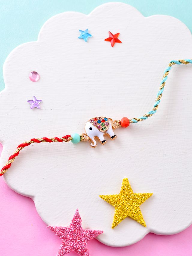 Playful Elephant Rakhi for Kids with Multicolor Threads and Charm (Rakhi is included with Roli Chawal & Greetings Card)