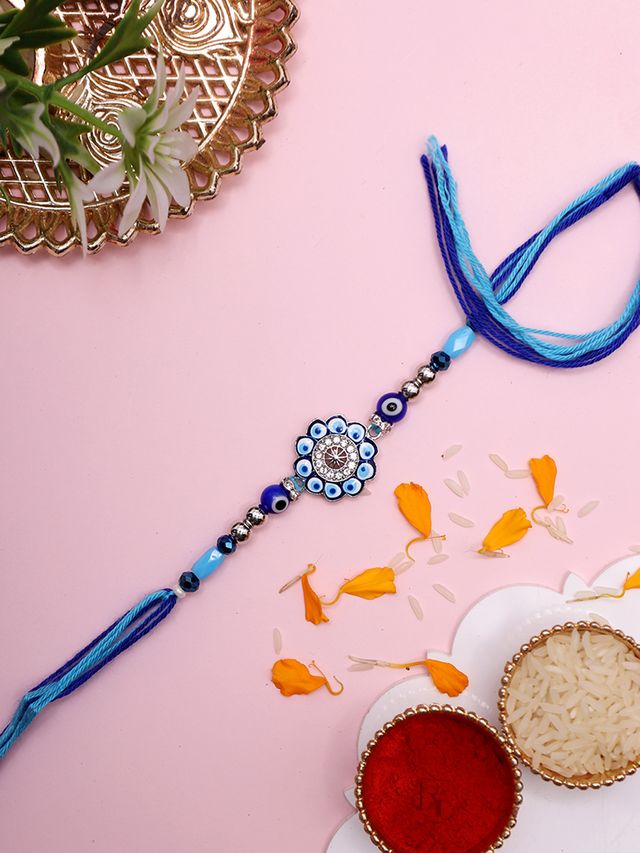 Designer Evil Eye Rakhi with Blue Floral Motif and Crystal Center (Rakhi is included with Roli Chawal & Greetings Card)