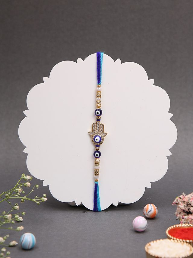 A Blue Thread Rakhi with Hamsa Hand and Evil Eye Charms (Rakhi is included with Roli Chawal & Greetings Card)