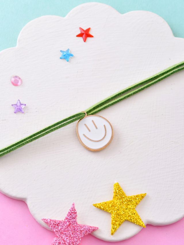 Smiley Face Rakhi for Kids with Green Thread (Rakhi is included with Roli Chawal & Greetings Card)