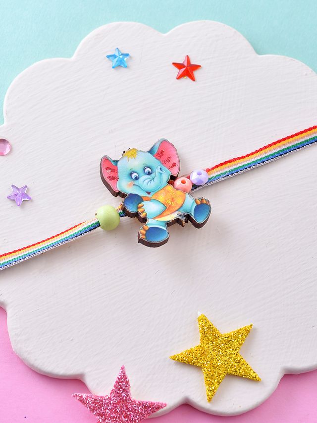 Playful Elephant Kids Rakhi with Rainbow Thread (Rakhi is included with Roli Chawal & Greetings Card)