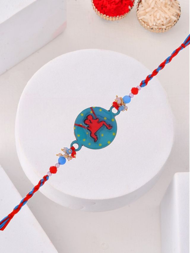 Blue-Red Rakhi with Dancing Kid Cartoon Centerpiece (Rakhi is included with Roli Chawal & Greetings Card)