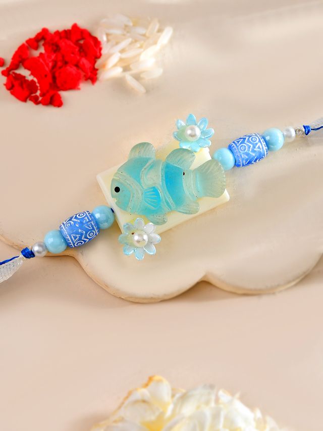 Aqua Fish Kids Rakhi with Blue Beads and Pearl Flowers (Rakhi is included with Roli Chawal & Greetings Card)