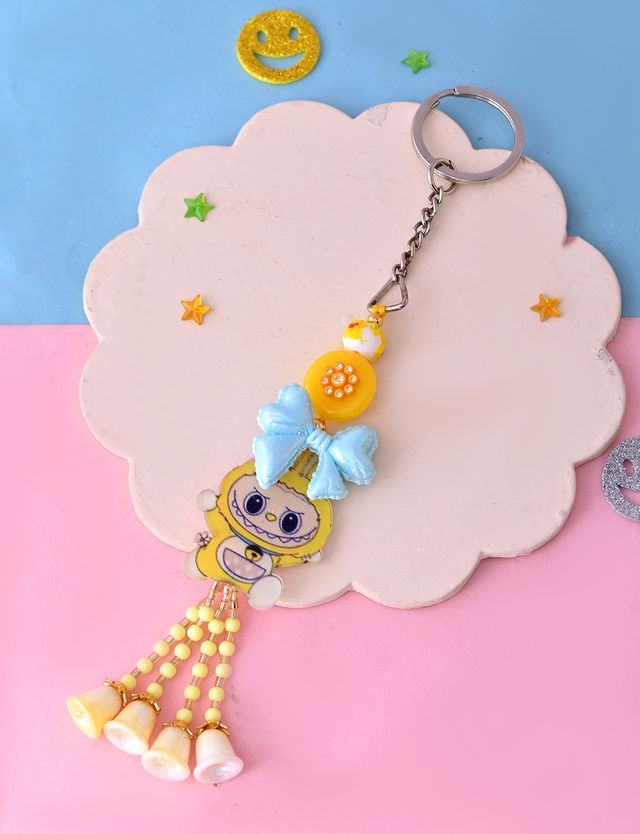 LOBOBO Yellow Bow Cartoon Keychain (Rakhi is included with Roli Chawal & Greetings Card)