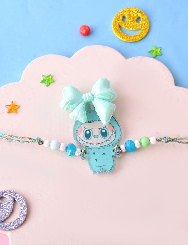 Mint Green Cartoon Bracelet with 3D Bow & Beads (Rakhi is included with Roli Chawal & Greetings Card)