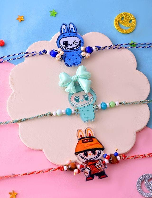 Red Rope Bunny Cartoon Bracelet with Flower Charm (Rakhi is included with Roli Chawal & Greetings Card)